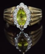 A 9ct gold ring set with a marquise cut peridot surrounded by diamonds, 4.0g, size R
