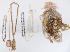 A collection of costume jewellery including necklaces, cameo brooch, etc