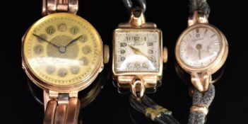 Three 9ct gold ladies wristwatches including Omega, one on 9ct gold expanding bracelet the other two