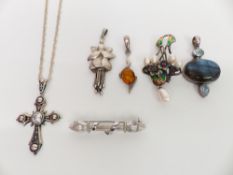 Four silver pendants, a silver Art Nouveau style brooch and another silver brooch