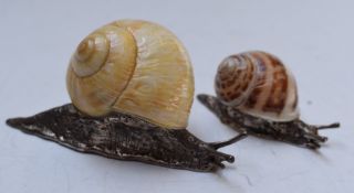Pair of novelty hallmarked silver snails, Birmingham 2001, maker CG & S, length of larger 8.5cm,