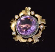 Edwardian gold pendant/ brooch set with a large round cut amethyst and seed pearls, 2.4cm, 4.5g