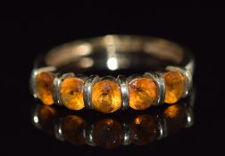 A 9ct gold ring set with five round cut citrines, 1.9g, size N