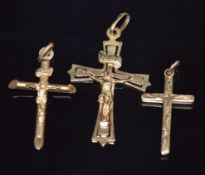 Two 9ct gold crucifix and a 9ct gold cross, 2.7g