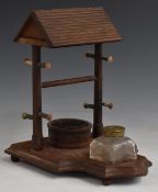Victorian or early 20thC novelty desk stand formed as a well, with glass inkwell, stamp wetter and