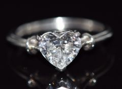 A white gold ring set with a heart cut moissanite, 3.5g, size K