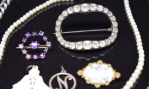 A silver brooch set with amethysts, silver necklaces, pearl necklace, pearl pendant and a foiled