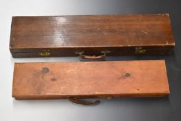 Two vintage wooden gun cases, both with fitted interiors, largest 85x21x10cm.
