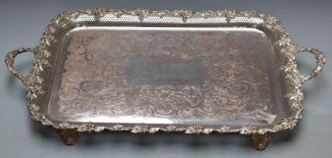 Large silver plated twin handled tray with pierced ridge and fruit and vine decoration raised on