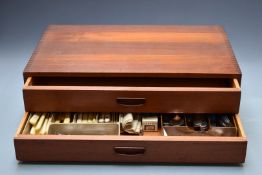 A retro teak G Plan or Ladderax two drawer canteen together with various cutlery, W60 x D38 x H17cm