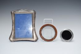 Three hallmarked silver photograph frames, largest to suit 6x4 inch photo and with blue velvet easel