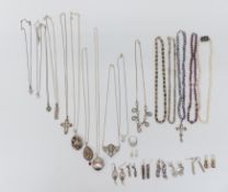 A collection of silver jewellery including necklaces, earrings, etc