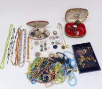 A collection of costume jewellery including Miracle brooch, scarab beetle necklace, silver brooch,