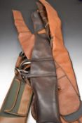 Six various shotgun or rifle slips including leather examples, some with wool linings.