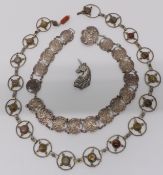 Art Nouveau silver plated belt, another silver plated belt set with agate and a silver brooch in the