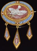 A Victorian brooch set with a micro mosaic depicting a dove carrying an olive branch, with three