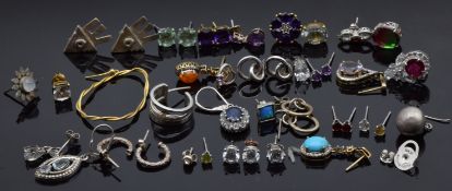 A collection of mainly single silver earrings
