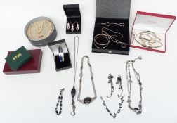A collection of silver jewellery including a suite of jewellery set with ivory, bangles,