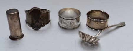 Three hallmarked silver napkin rings, hallmarked silver sifter spoon and a Tiffany pepper marked