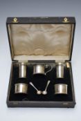 Cased George VI hallmarked silver cruet set comprising two open salts, two peppers, mustard and