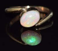 A 9ct gold ring set with an oval opal cabochon, 2.3g, size H