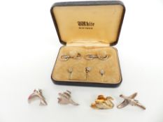 Four silver pins and a stud set