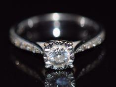 A 9ct white gold ring set with diamonds totalling approximately 0.4ct, size K, 2.6g