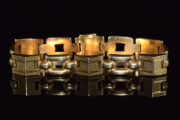 An 18ct gold bracelet made up of square buckle links and engine turned links, 33g