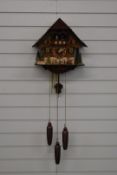 Large three train Black Forest cuckoo clock with musical dancer feature, waterwheel and woodman