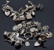 Two silver charm bracelets with over 30 charms including thistle, car, anchor, acorn, elephant,