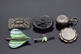 A silver sovereign holder, silver brooches set with marcasite, Victorian silver brooch, jet brooch
