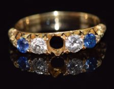 An 18ct gold ring set with a sapphire and diamonds, 2.8g, size N