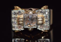 Art Deco ring set with rose cut diamonds in a stylised bow setting, the central diamond