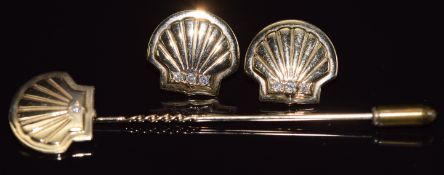 A 9ct gold stick pin and matching earrings in the form of shells set with diamonds, 10.5g