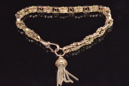A 9ct rose gold Victorian bracelet made from a fob chain with embossed and pierced links with tassel