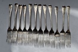 Twelve Georgian and early Victorian hallmarked silver dessert forks, with bright cut decoration,
