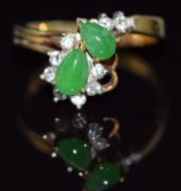 A 14k gold ring set with two pear cut jade cabochons and diamonds, 3.2g, size K