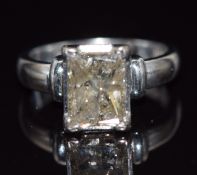 An 18ct white gold ring set with an emerald cut diamond of approximately 3.2ct, size M, 7.5g