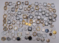 A collection of gold plated and stainless steel wristwatch cases together with various other watch