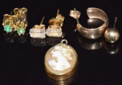 A pair of 9ct gold earrings set with an emerald to each, a pair of 9ct gold earrings set with
