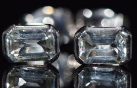 A pair of 18ct white gold earrings set with an emerald cut aquamarine to each, 2.3g