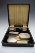 Cased Art Deco hallmarked silver mounted dressing table set comprising hand mirror, two brushes