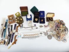 A collection of costume jewellery including necklaces, brooches, silver necklace and earrings,