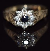 A 9ct gold ring set with cubic zirconia and a sapphire, 2.5g, size K