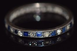 A c1920 eternity ring set with alternating sapphires and diamonds, 1.1g, size K