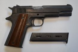 BBM Bruni 96 Automatic 8mm blank firing pistol with wooden grips and a spare magazine.