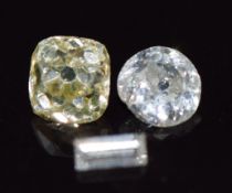 A loose cushion cut yellow diamond (0.16g), a loose round cut diamond (0.08g) and a loose baguette