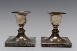 Pair of Walker and Hall Art Deco hallmarked silver squat, square candlesticks with Greek key