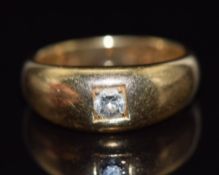 An 18ct gold ring set with a round cut diamond, London 1931, 8g, size L
