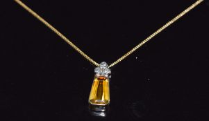 An 18ct gold pendant set with a yellow sapphire and three diamonds on an 18ct gold chain, 3.2g